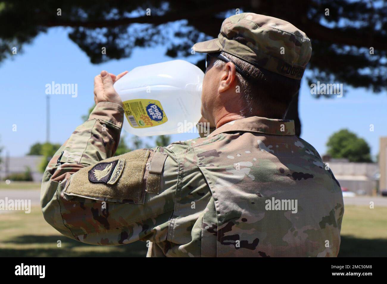 Sergeant First Class Jacab Cooper, 101st Airborne Division (Air Assault), drinks water to combat the heat June 24. Nita Hackwell preventative medicine and environmental health at Blanchfield Army Community Hospital, or BACH, said residents can avoid heat injury by knowing what to expect outside. “The heat line provides the wet bulb globe temperature, or WBGT, index and heat category to members of the Fort Campbell community training, working, and playing outdoors in direct sunlight,” she said. “Monitoring the WBGT index is an important step in determining when modifications to outdoor physical Stock Photo