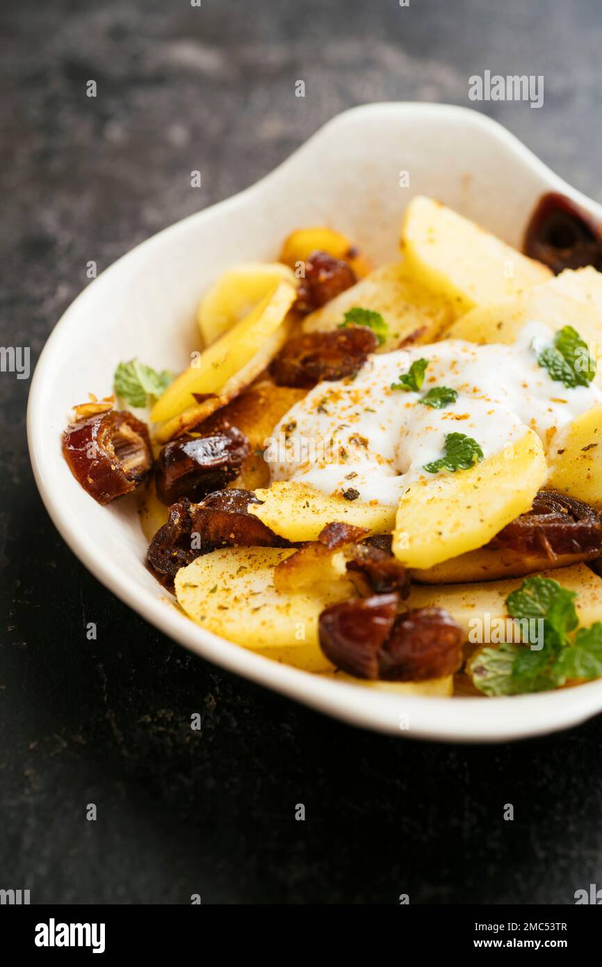 Sauteed Parsnips with Dates and Spicy Soy Yogurt Stock Photo