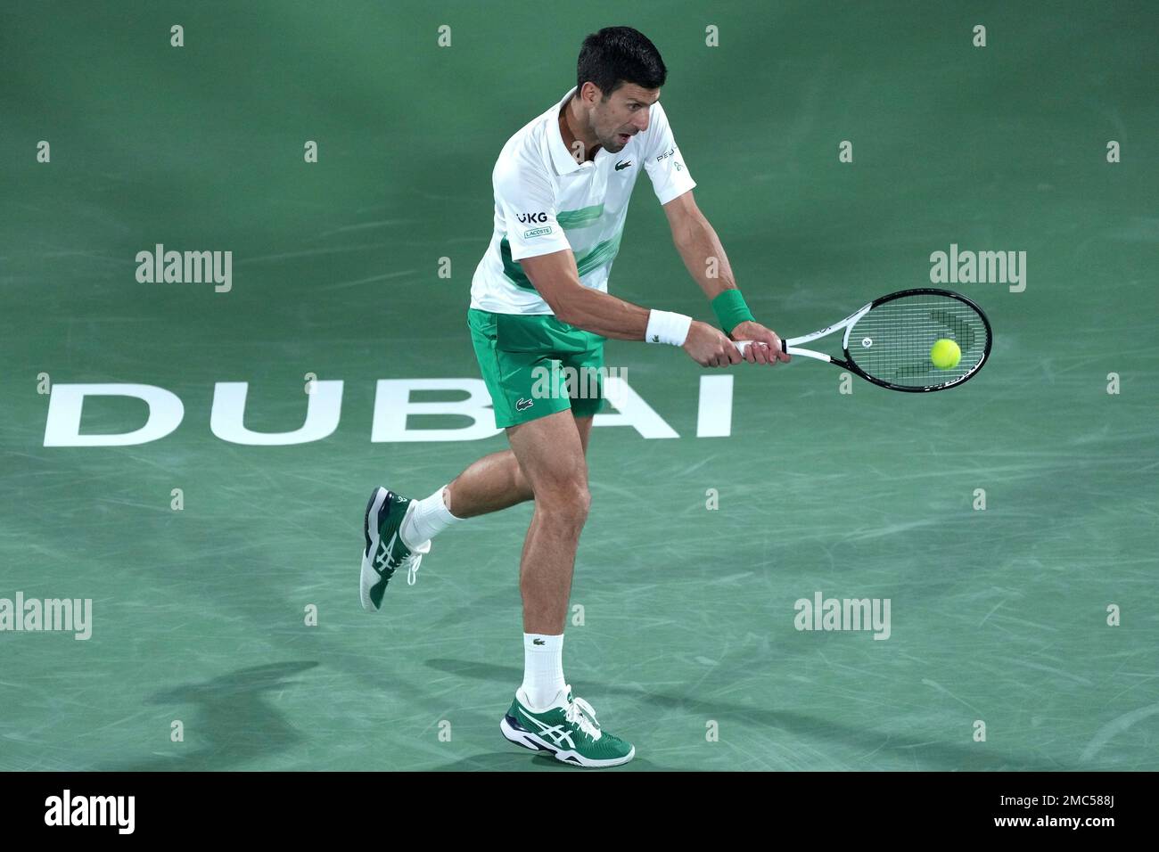 Serbias Novak Djokovic returns the ball to Italys Lorenzo Musetti during a match of the Dubai Duty Free Tennis Championship in Dubai, United Arab Emirates, Monday, Feb