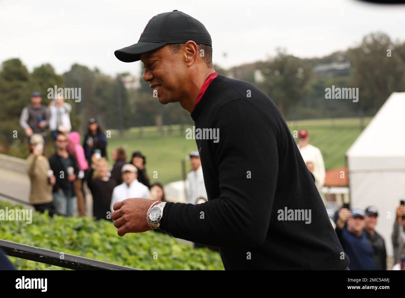 Tiger Woods walks off the course following the trophy ceremony on the 18th green after the Genesis Invitational golf tournament at Riviera Country Club, Sunday, Feb