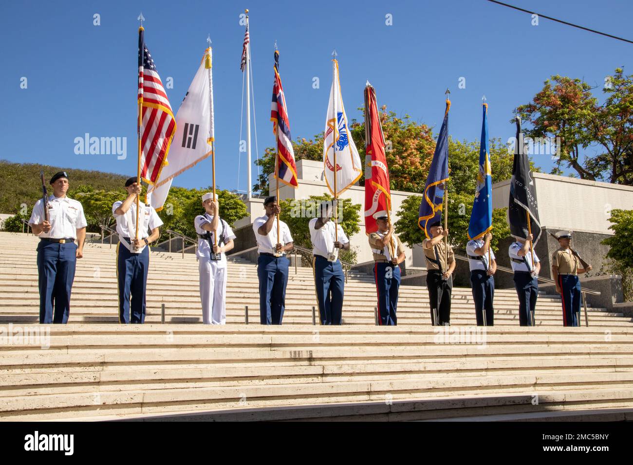 The U.S. Indo-Pacific Command Joint Service Color Guard presents the colors during the National Memorial Cemetery of the Pacific (Punchbowl) in Honolulu, Hawaii, June 25, 2022. The Korean War began on June 25, 1950, when North Korean armed forces invaded South Korea. The attack took place at several strategic points along the 38th parallel, the line dividing the communist Democratic People’s Republic of Korea from the Republic of Korea in the south. This event honors the lives lost and the sacrifices made during the war. Stock Photo