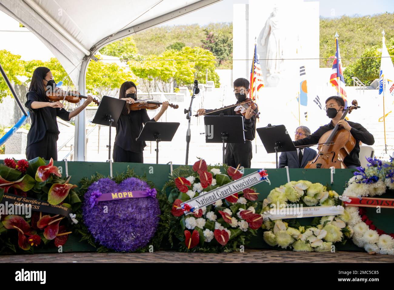A string quartet from Hawaii Symphony Orchestra perform a special musical session during the 72nd Korean War Anniversary at the National Memorial Cemetery of the Pacific (Punchbowl) in Honolulu, Hawaii, June 25, 2022. The Korean War began on June 25, 1950, when North Korean armed forces invaded South Korea. The attack took place at several strategic points along the 38th parallel, the line dividing the communist Democratic People’s Republic of Korea from the Republic of Korea in the south. This event honors the lives lost and the sacrifices made during the war. Stock Photo