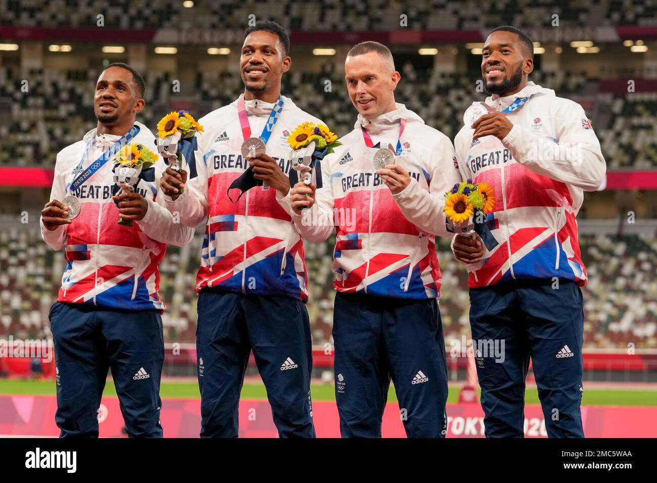 FILE Silver medalist, team Britain, from left, Chijindu Ujah, Zharnel