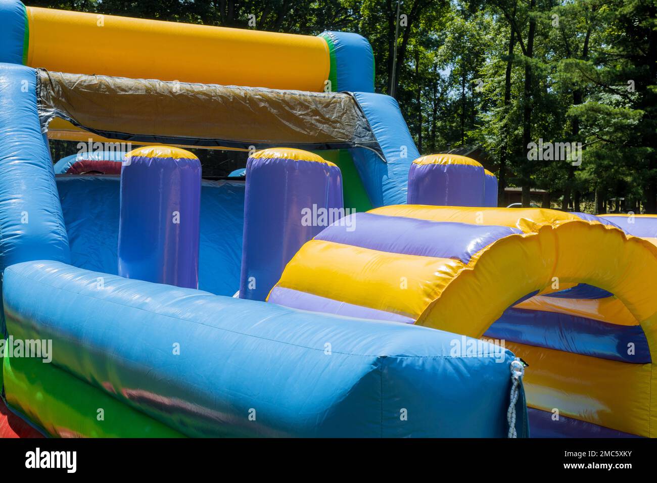 At playground for children in park, there is an inflatable attraction ...