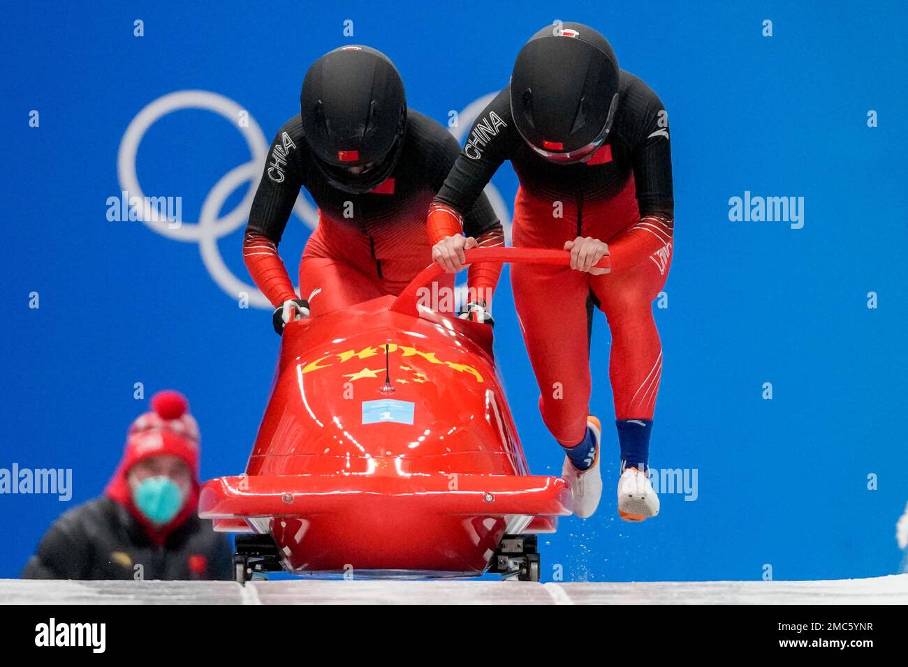 Huai Mingming and Wang Xuan, of China, slide during the womens bobsleigh heat 1 at the 2022 Winter Olympics, Friday, Feb