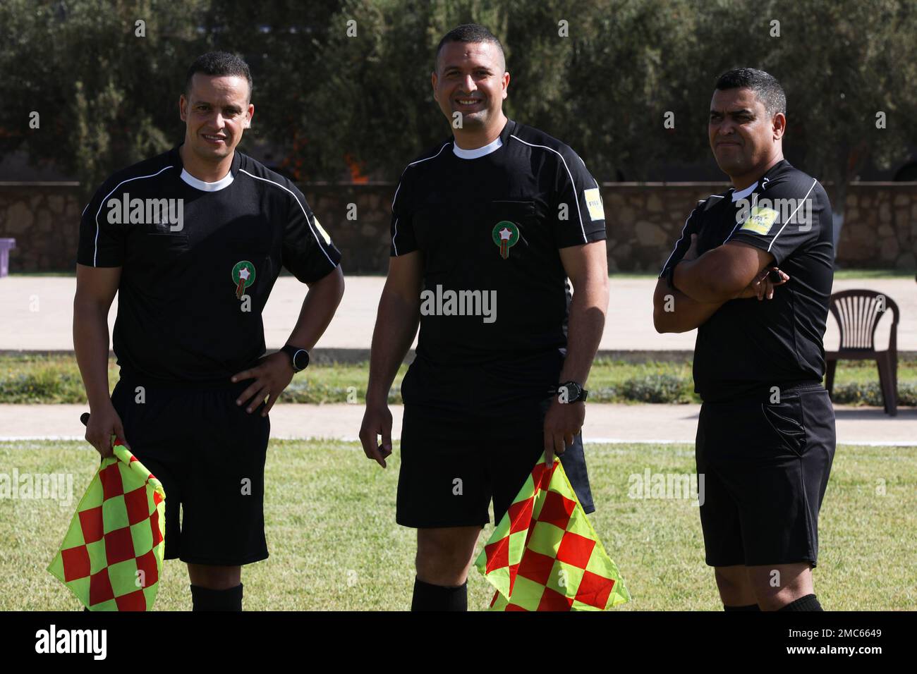 The referees pose for a photo before a camaraderie-building multinational soccer game during African Lion 22 at Southern Zone Headquarters, Agadir, Morocco, June 25, 2022. African Lion 22 is U.S. Africa Command's largest, premier, joint, annual exercise hosted by Morocco, Ghana, Senegal and Tunisia, June 6 - 30. More than 7,500 participants from 28 nations and NATO train together with a focus on enhancing readiness for U.S. and partner nation forces. AL22 is a joint all-domain, multi-component, and multinational exercise, employing a full array of mission capabilities with the goal to strength Stock Photo