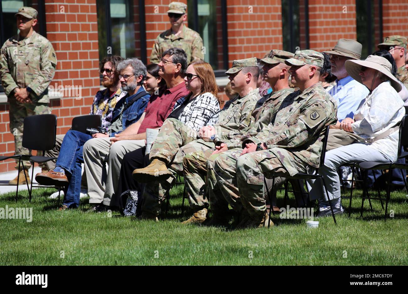 Col. Jim Perrin, Commander of the 81st Stryker Brigade Combat Team, Command Sgt. Maj. Kelly Wickel, Senior Enlisted Leader of the 81st Stryker Brigade Combat Team and Lt. Col. Matt Braddock, former commander of the 2nd Battalion, 146th Field Artillery Regiment observe the ribbon cutting ceremony for the Thurston County Readiness Center in Tumwater, Wash. on June 25, 2022. The new readiness center will be the home of 2nd Battalion, 146th Field Artillery Regiment and serve as the hub for the Washington National Guard’s operations in Southwest Washington. Stock Photo