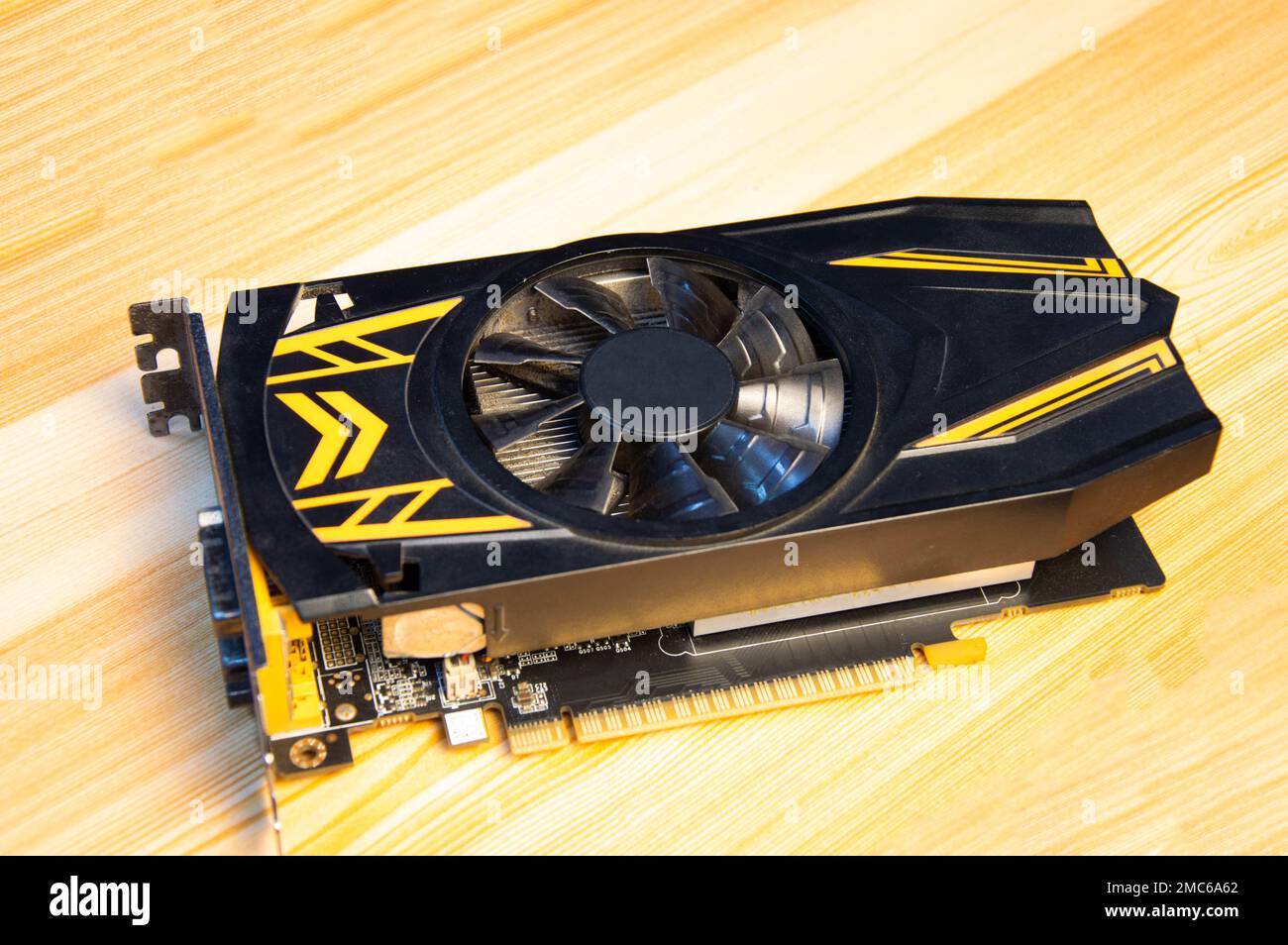 computer graphics card old condition placed on wooden floor Stock Photo