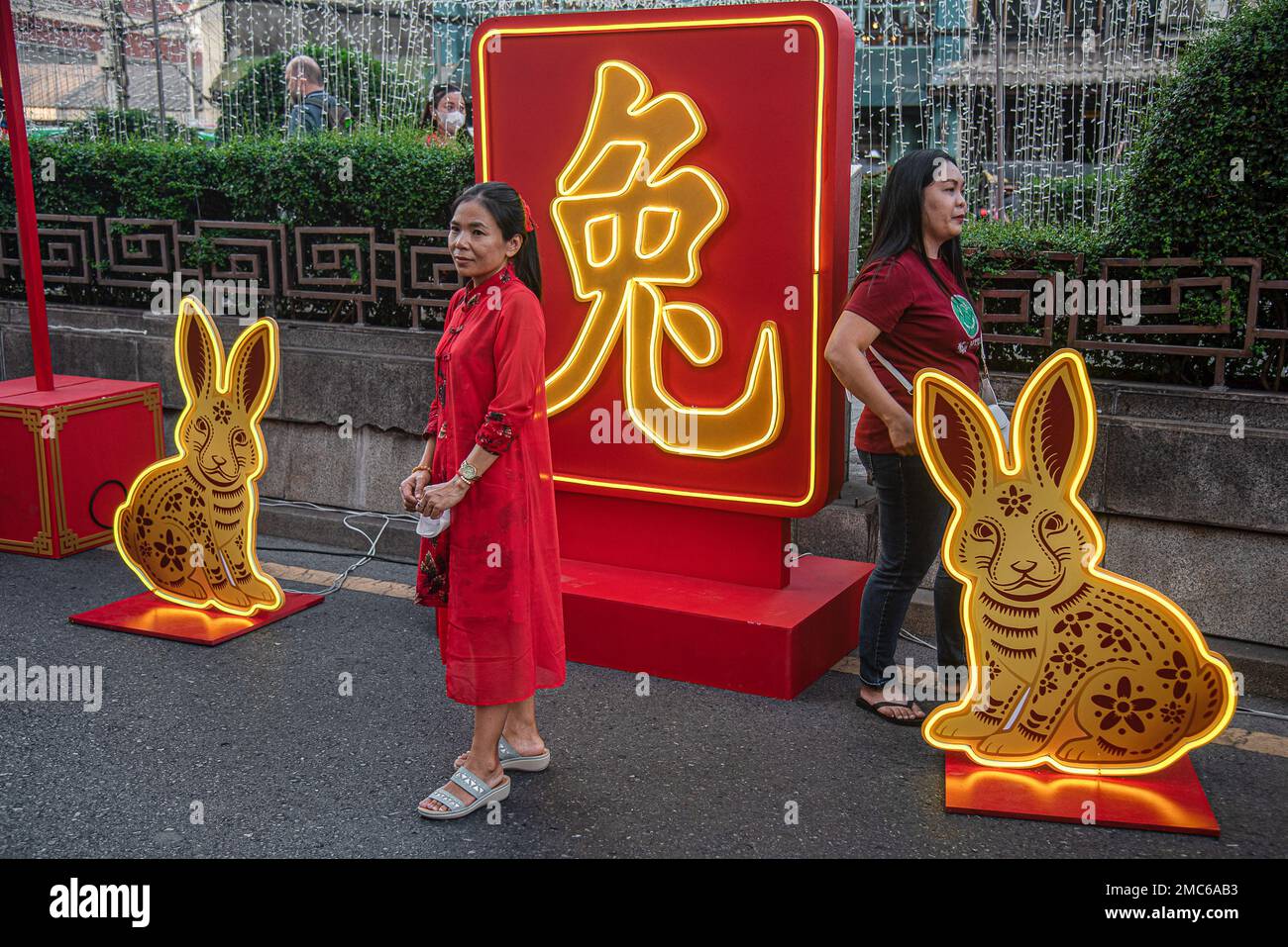 Bangkok, Thailand. 21st Jan, 2023. Women pose for a picture next to a light sculpture in rabbit theme during the Lunar new year celebration at Bangkok's Chinatown. Credit: SOPA Images Limited/Alamy Live News Stock Photo
