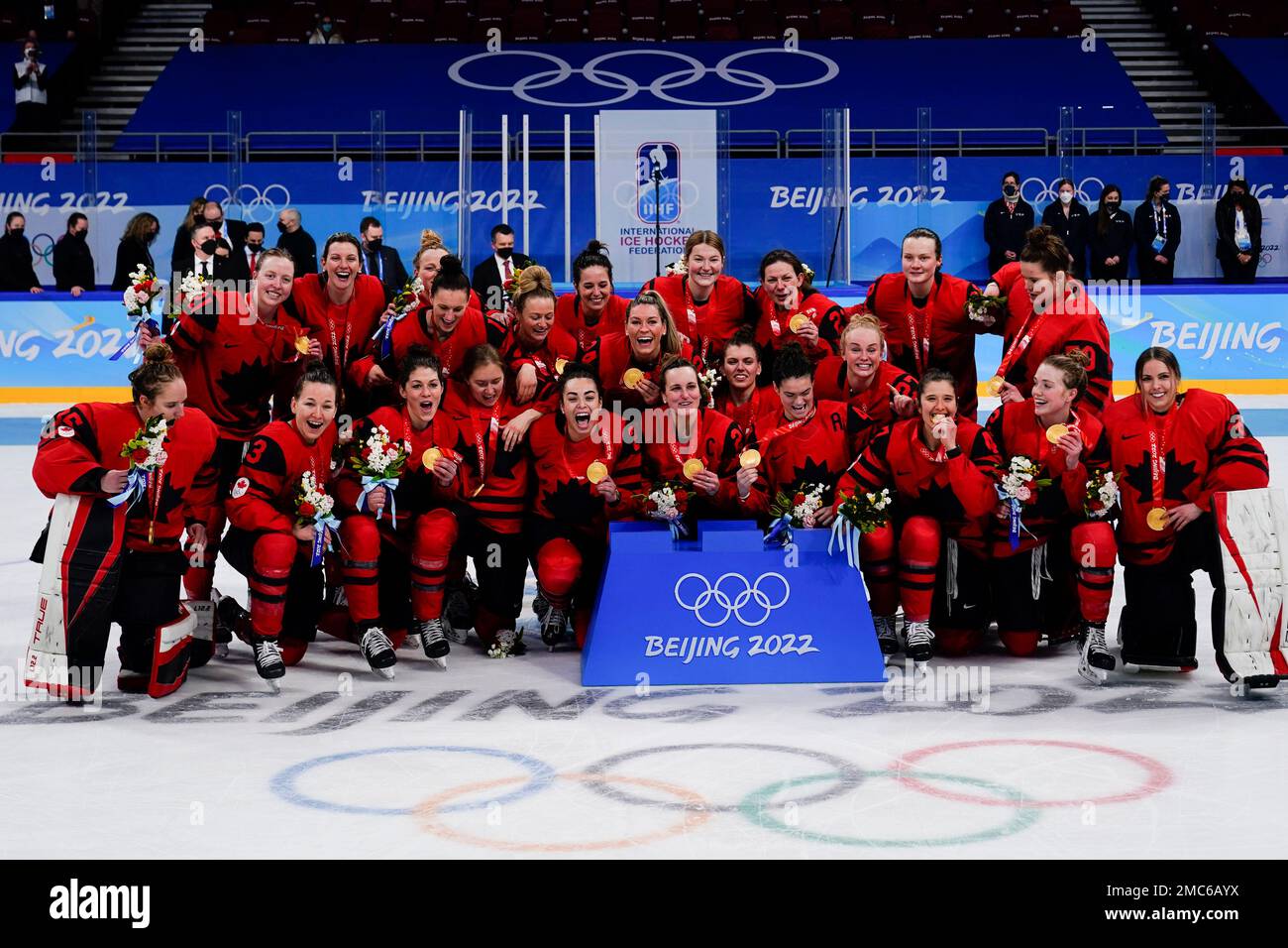 Team Canada poses with their gold medals following the women's gold