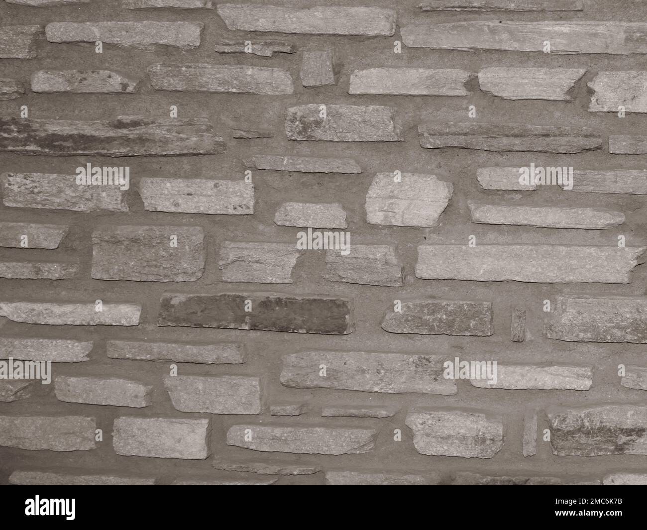 Old grungy stonewall . Strong texture for background backdrop Stock Photo