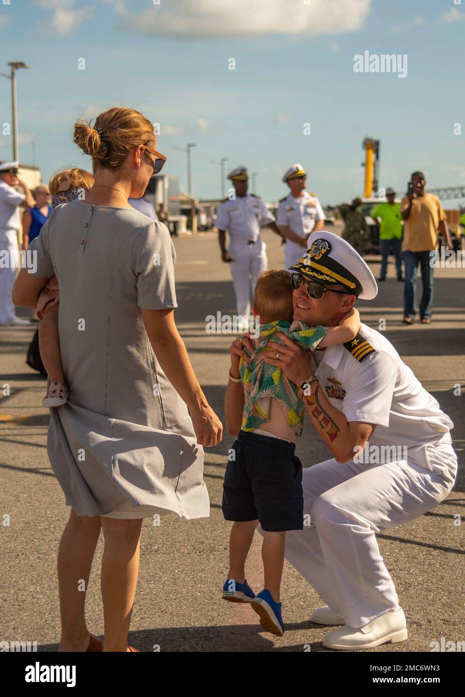 220626-N-UP745-1209  NAVAL STATION MAYPORT, Fla. (June 26, 2022) Cmdr. Robert Keller, executive officer of the Arleigh Burke-class guided-missile destroyer USS Jason Dunham (DDG 109), reunites with his family as the ship returns to Naval Station Mayport, Florida after a regularly scheduled deployment in support of maritime security operations and theater security cooperation efforts, June 26. Jason Dunham was deployed as part of the Harry S. Truman Carrier Strike Group. Stock Photo