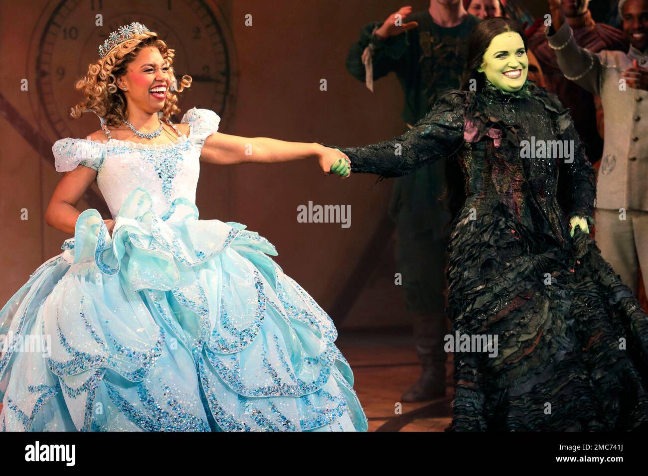 Actors Brittney Johnson, left, and Lindsay Pearce hold hands on stage  during the curtain call of the musical "Wicked" at the Gershwin Theatre on  Monday, Feb. 14, 2022, in New York. (Photo