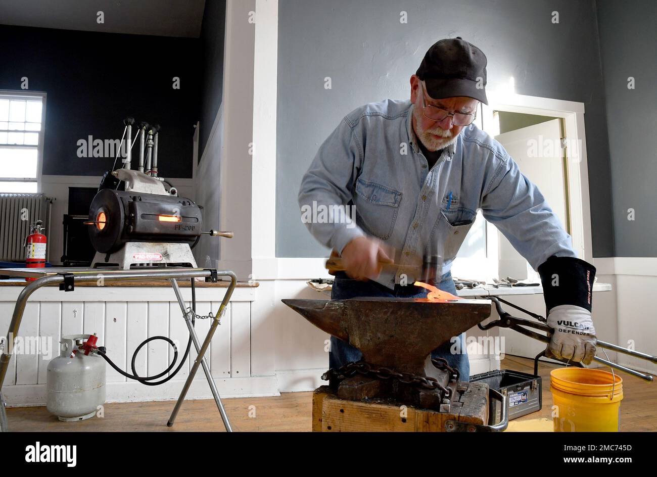 Fred Martin, a volunteer blacksmith for the nonprofit group RAWtools