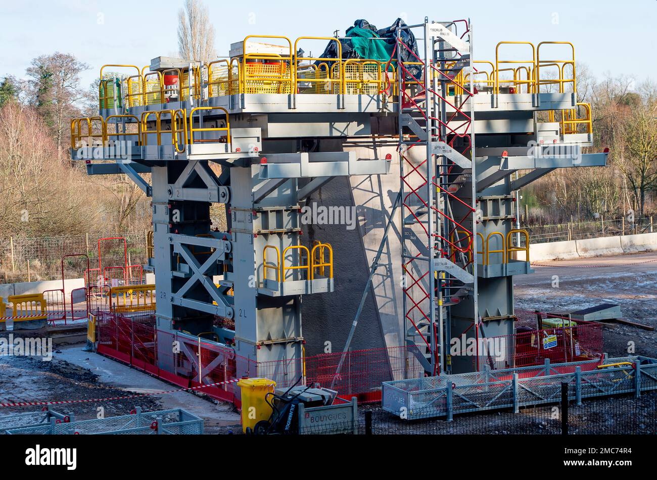 Denham, UK. 21st January, 2023. The HS2 High Speed Rail 2 Colne Valley Viaduct under construction. The bridge now crosses the A412 London Oribtal Road in Denham and this week, a milestone of 500 metres has been completed. Dominque, a huge 160m long orange coloured 700 tonne bridge building machine called a launch girder, is winching pre cast concrete deck segments into place onto 56 pier segments. The Colne Valley Viaduct will be longest railway bridge in the UK once it is complete. Credit: Maureen McLean/Alamy Live News Stock Photo