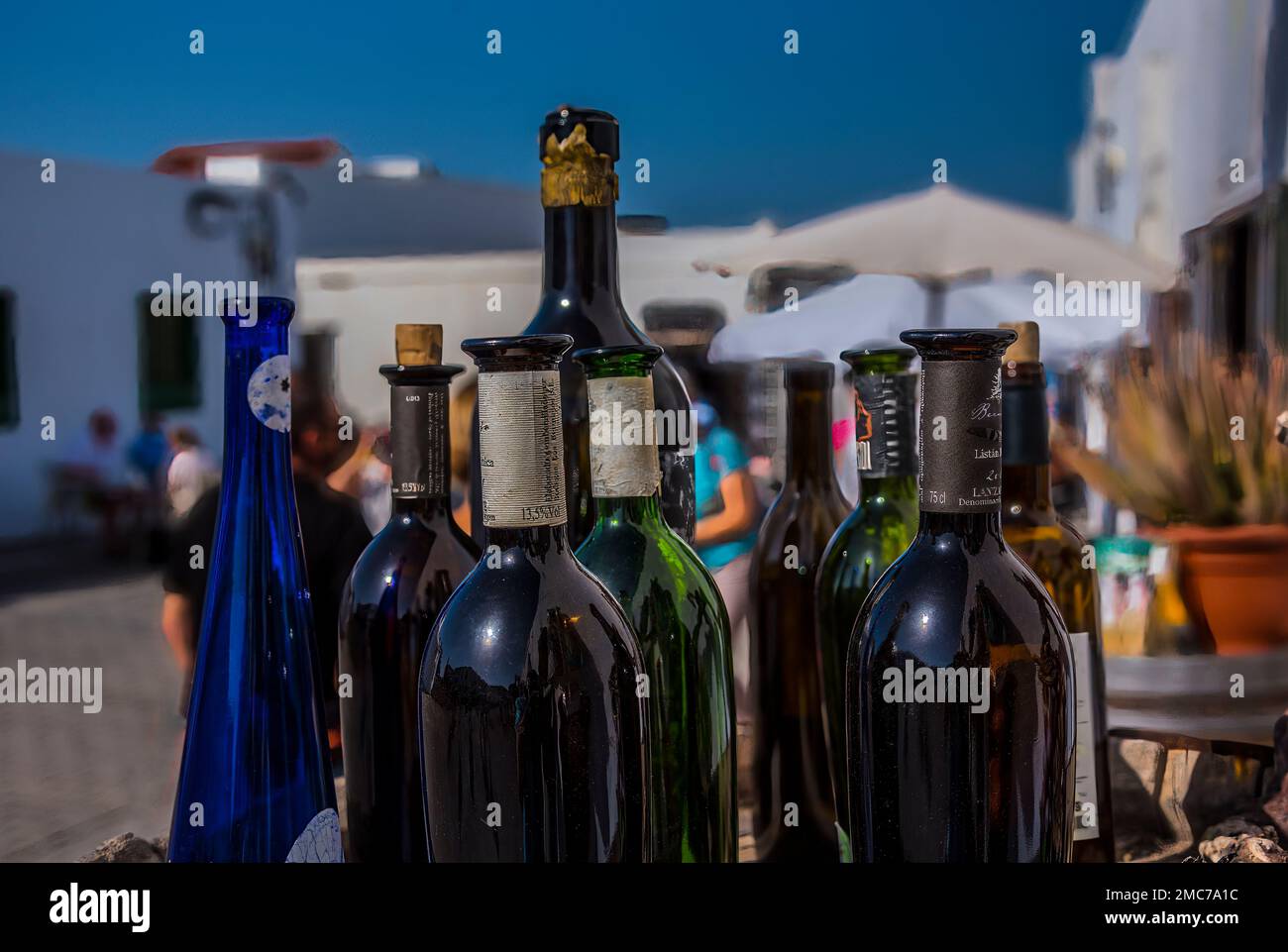 Wine bottles on display outside shop/bar at market in Lanzarote Stock Photo