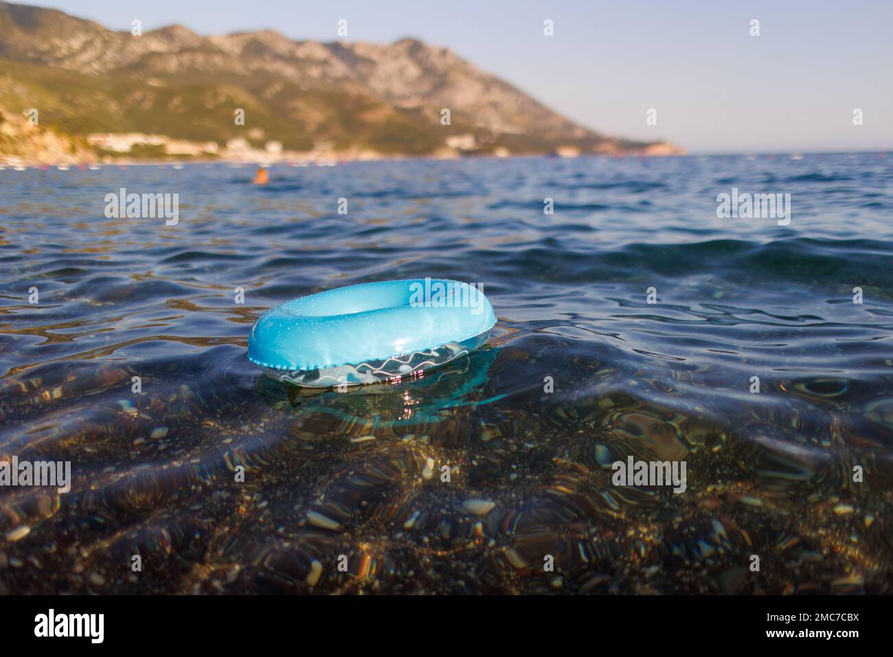 A blue rubber ring floats in the Adriatic Sea Stock Photo