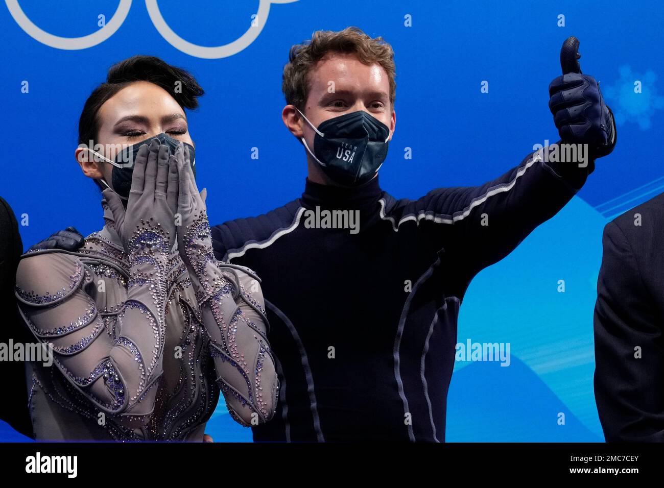 Madison Chock and Evan Bates, of the United States, react following