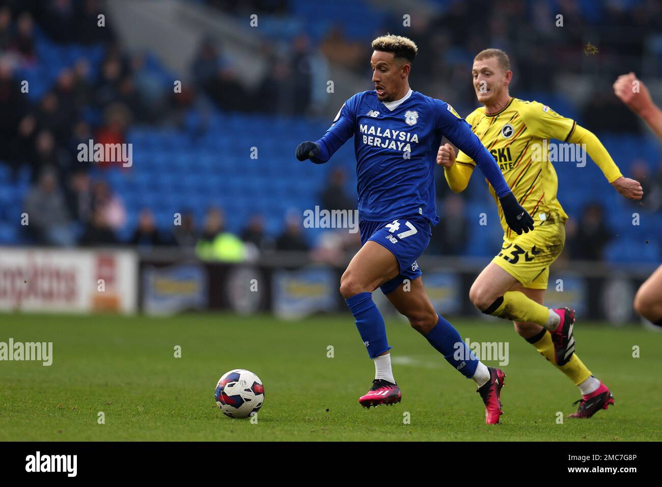 Cardiff, UK. 21st Jan, 2023. Callum Robinson of Cardiff city breaks away from George Saville of Millwall. EFL Skybet championship match, Cardiff city v Millwall at the Cardiff City Stadium in Cardiff, Wales on Saturday 21st January 2023. this image may only be used for Editorial purposes. Editorial use only, license required for commercial use. No use in betting, games or a single club/league/player publications. pic by Andrew Orchard/Andrew Orchard sports photography/Alamy Live news Credit: Andrew Orchard sports photography/Alamy Live News Stock Photo