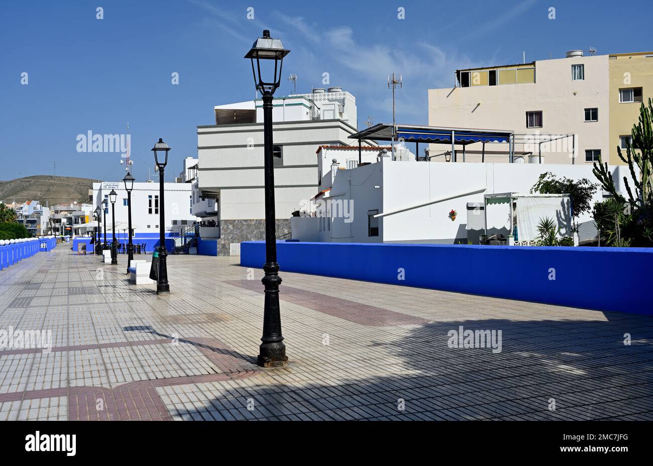 Seaside promenade, Plaza de los Tunidos,  “along Av. del Muelle” village of  Arguineguín, Las Palmas, Gran Canaria, Spain Stock Photo