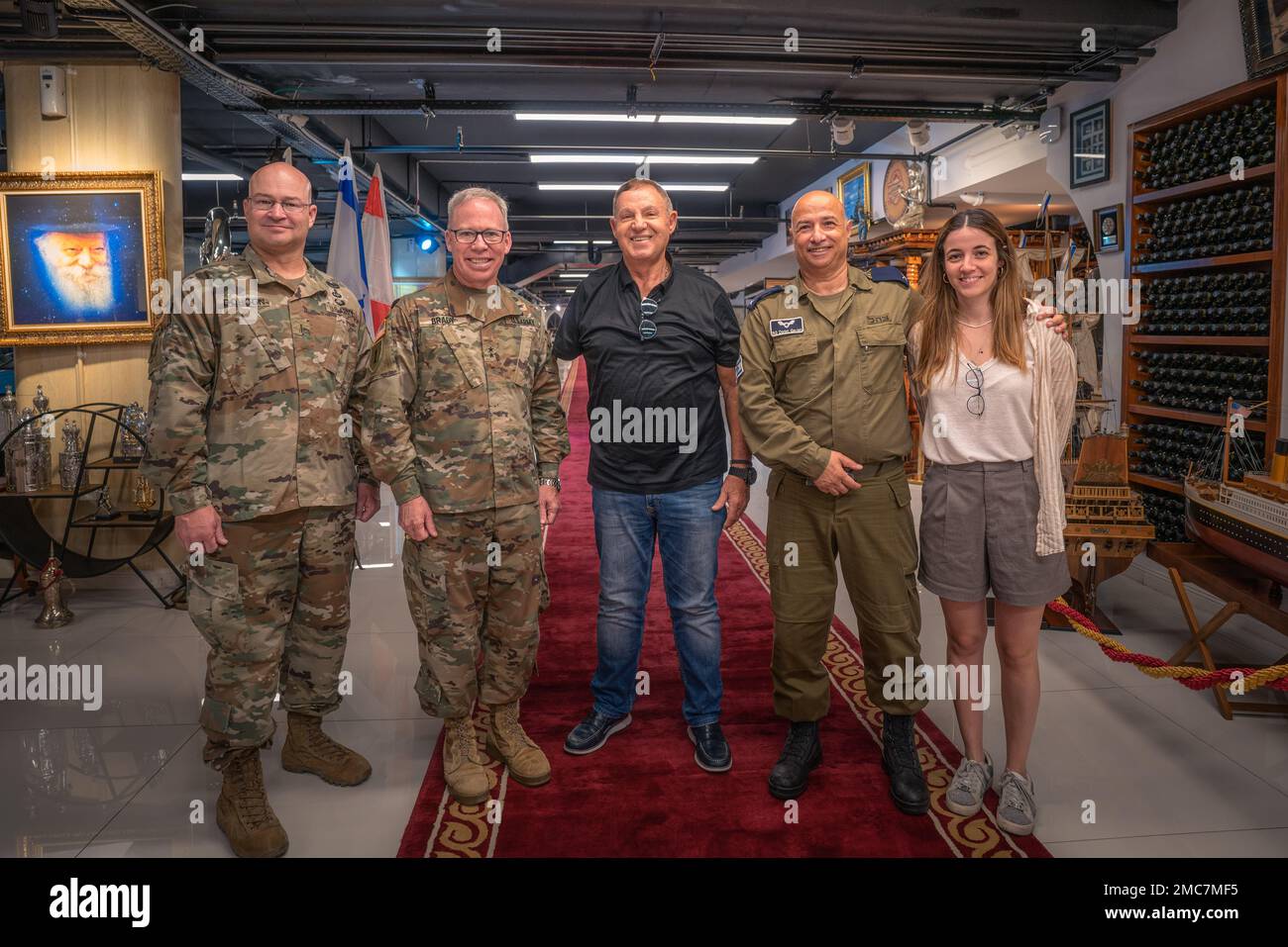 (Left to Right) U.S. Army Command Chief Warrant Officer 5 Wesley Dohogn, Maj. Gen. Greg Brady, Commanding General of the 10th Army Air and Missile Defense Command, Mr. Moshe Levy, Israeli Defense Forces Brig. Gen. Doron Gavish and his daughter pose for a photo during a meeting on June 26, 2022, in Tel Aviv, Israel. Mr. Levy received the Medal of Valor for his actions in Sinai during the Yom Kippur War in 1973. Maj. Gen. Brady had the honor of meeting Mr. Levy while in town to meet with Israeli Defense Force counterparts. Stock Photo