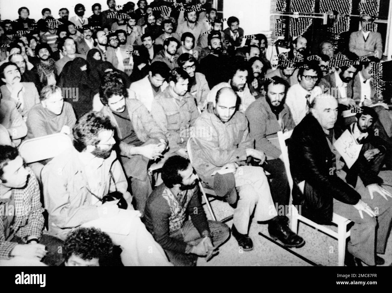Amir Abbas Hoveida, dark jacket, right, former prime minister of Iran