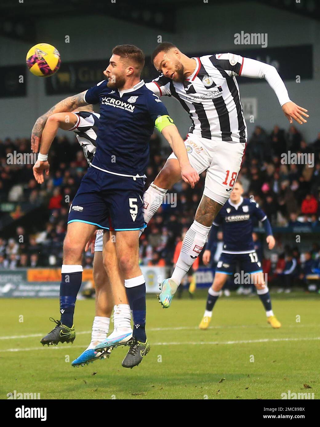 21st January 2023;  St Mirren Park, Paisley, Renfrewshire, Scotland, Scottish Cup Fourth Round Football, St Mirren versus Dundee; Charles Dunne of St Mirren heads clear from Ryan Sweeney of Dundee Stock Photo