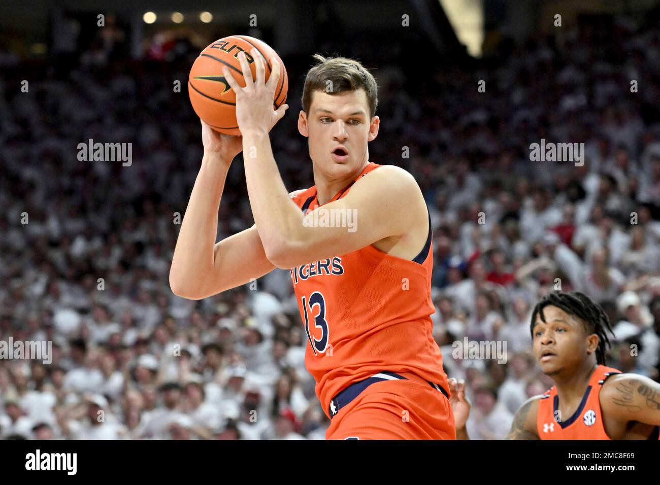 Auburn forward Walker Kessler (13) pulls down a rebound against