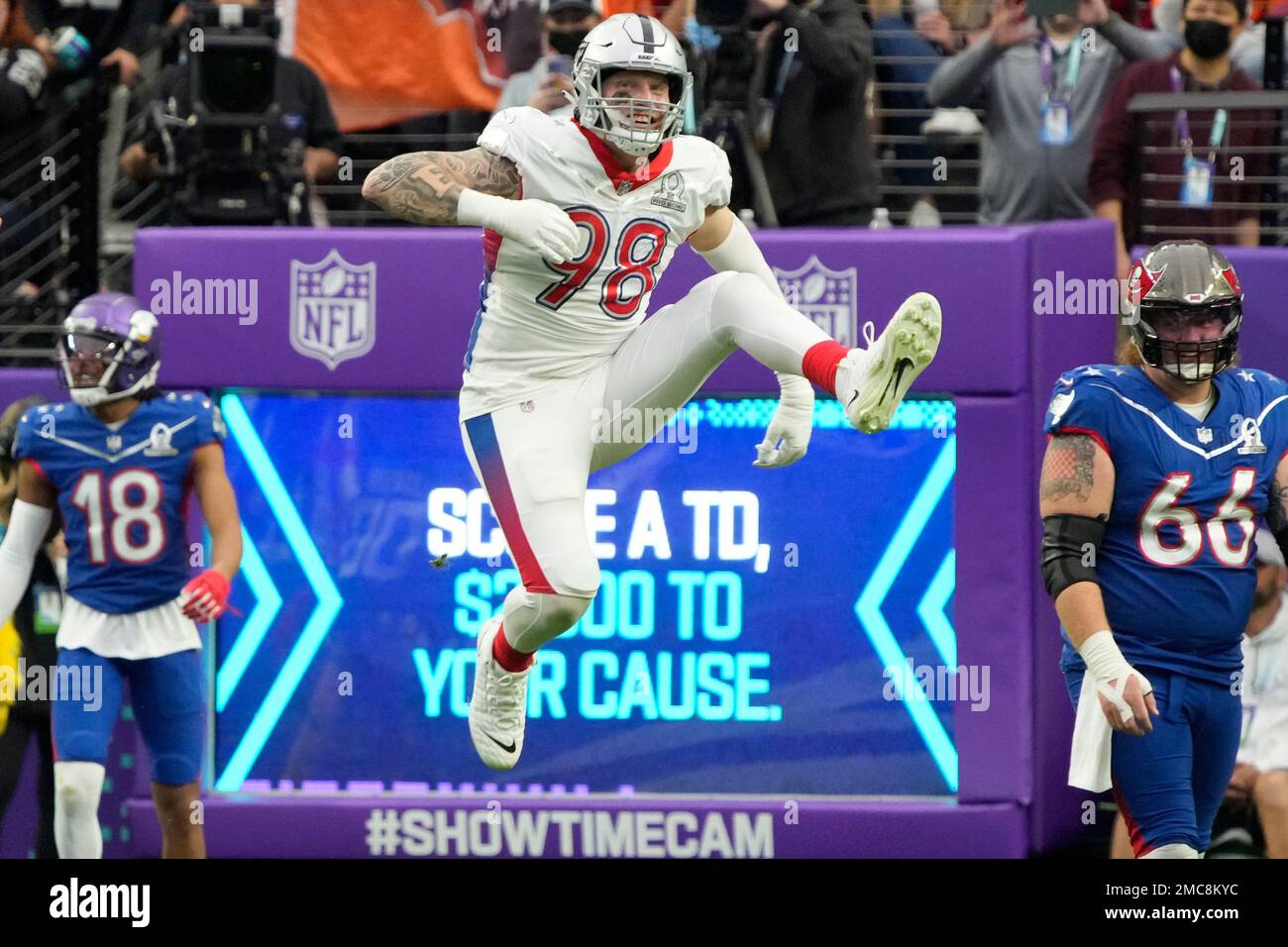 AFC defensive end Maxx Crosby of the Las Vegas Raiders (98) celebrates  after a play against the NFC during the Pro Bowl NFL football game, Sunday,  Feb. 6, 2022, in Las Vegas. (