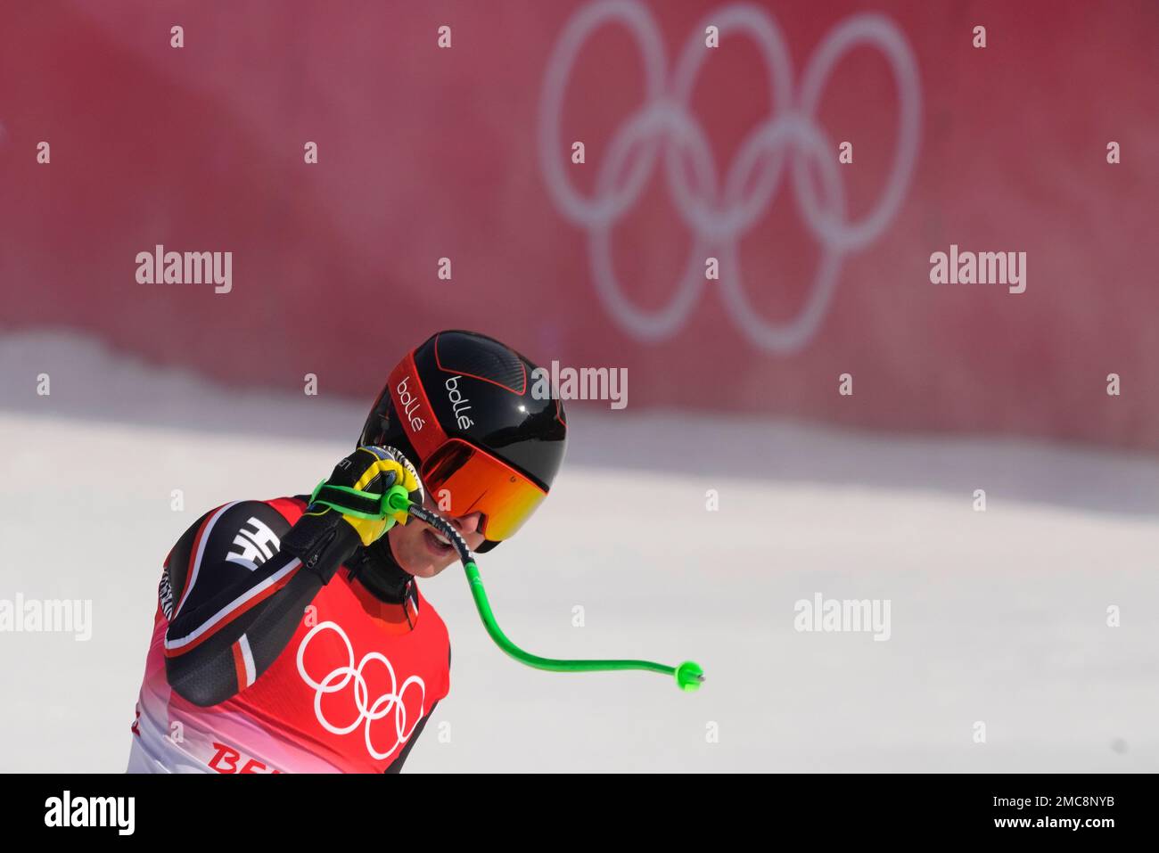 Brodie Seger of Canada reacts after finishing the downhill part