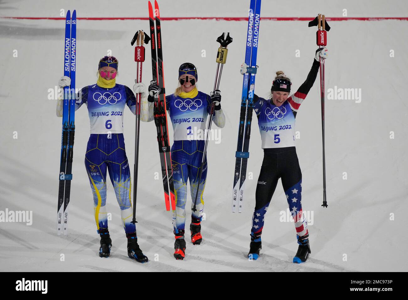 From left, silver medal finisher Maja Dahlqvist, of Sweden, gold medal  finisher Jonna Sundling, of Sweden, and bronze medal finisher Jessie  Diggins pose after the women's final sprint free cross-country skiing  competition