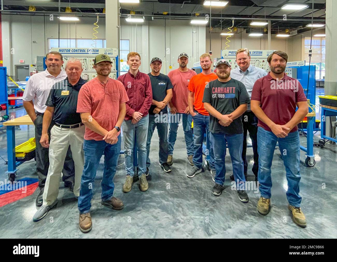 Team members from Crane Army Ammunition Activity attend an electric