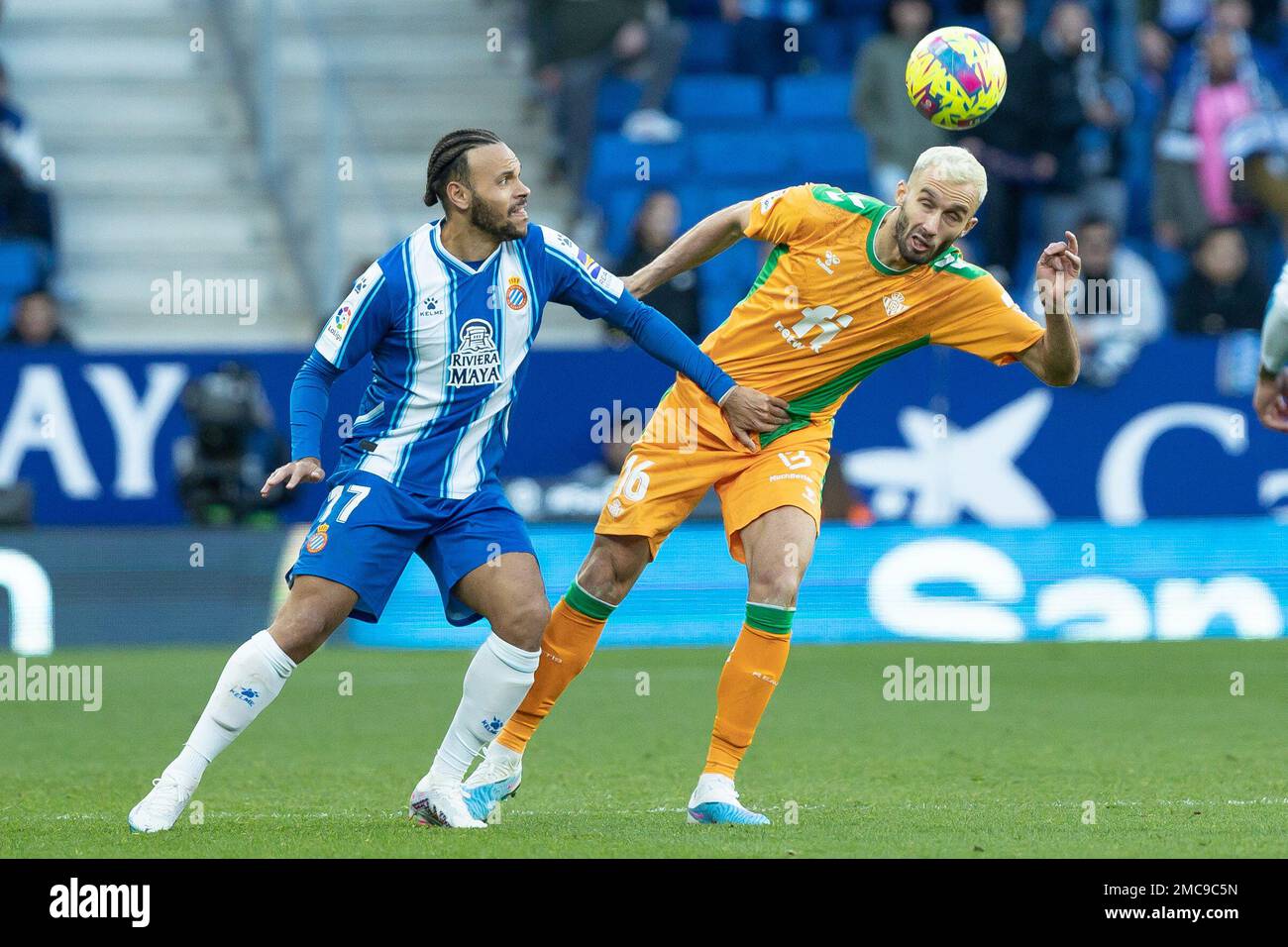 Martin Braithwaite of RCD Espanyol in action with German Pezzella of Real Betis during the Liga match between RCD Espanyol and Real Betis at RCDE Stadium in Cornella, Spain. Stock Photo