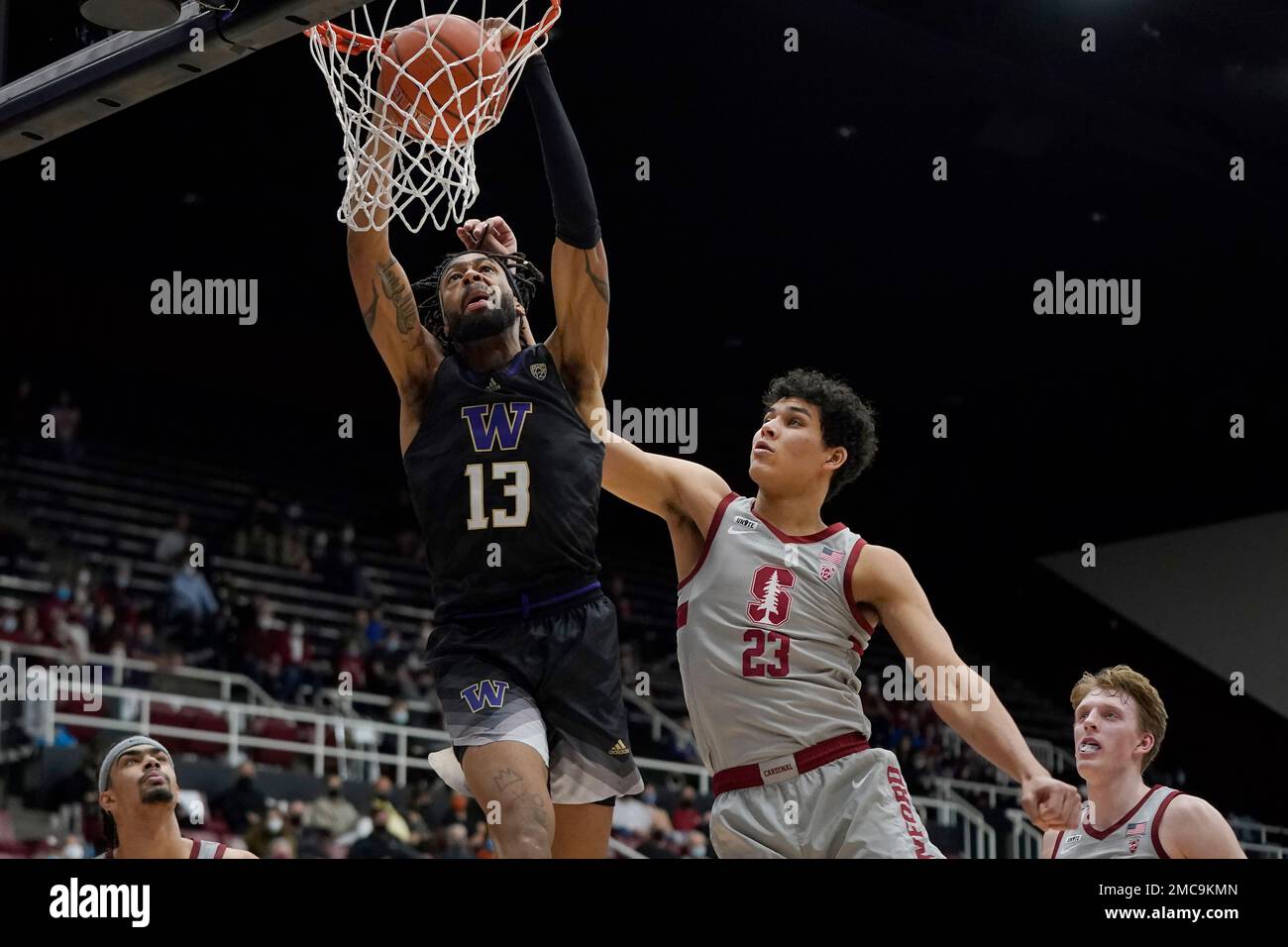 Washington forward Langston Wilson (13) dunks against Stanford forward