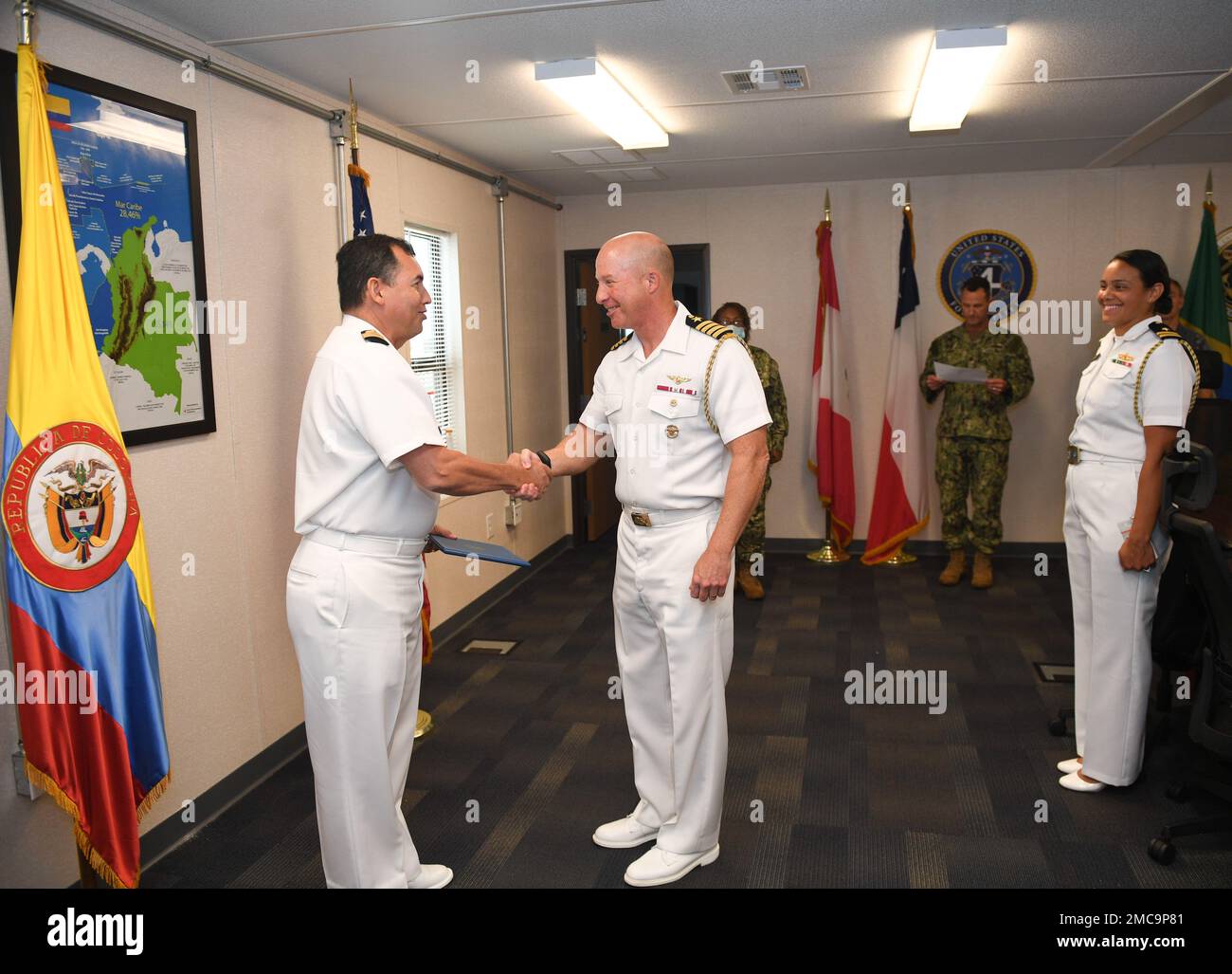 220628-N-DB801-0344  MAYPORT, Fla. – (June 28, 2022) – Colombian navy Capt. Nelson Villalba, left, a Foreign Liaison Officer assigned to U.S. Naval Forces Southern Command/U.S. 4th Fleet shakes hands with Capt. Michael Weaver, U.S. 4th Fleet Chief of Staff, after receiving the Navy and Marine Corps Commendation Medal during his end of tour award ceremony at fleet headquarters, June 28, 2022. Villalba served at U.S. 4th Fleet from Jan. 1, 2021 to June 30, 2022. U.S. Naval Forces Southern Command/U.S. 4th Fleet supports U.S. Southern Command’s joint and combined military operations by employing Stock Photo