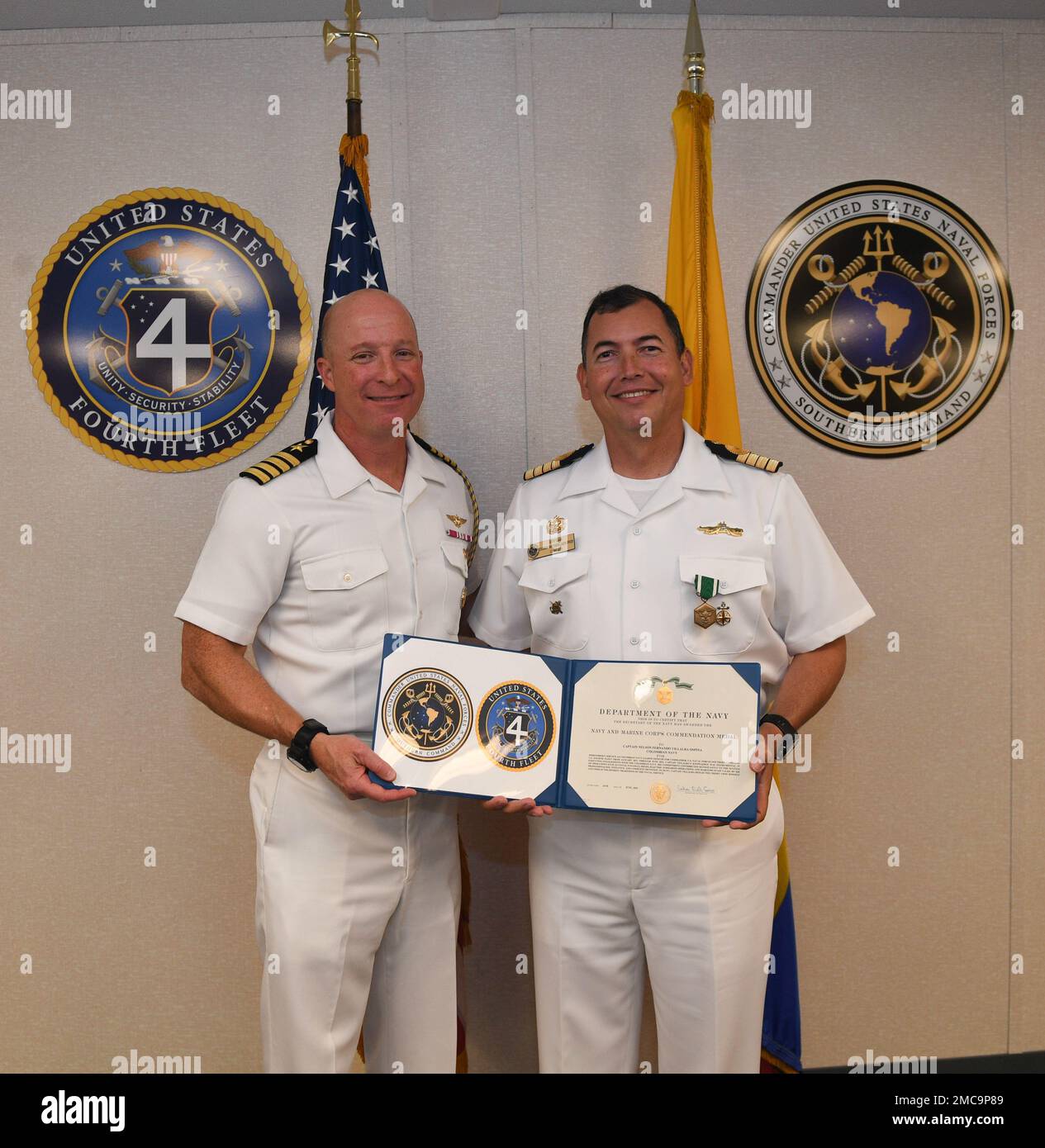 220628-N-DB801-0370  MAYPORT, Fla. – (June 28, 2022) – Colombian navy Capt. Nelson Villalba, right, a Foreign Liaison Officer assigned to U.S. Naval Forces Southern Command/U.S. 4th Fleet poses with Capt. Michael Weaver, U.S. 4th Fleet Chief of Staff, after receiving the Navy and Marine Corps Commendation Medal during his end of tour award ceremony at fleet headquarters, June 28, 2022. Villalba served at U.S. 4th Fleet from Jan. 1, 2021 to June 30, 2022. U.S. Naval Forces Southern Command/U.S. 4th Fleet supports U.S. Southern Command’s joint and combined military operations by employing mariti Stock Photo