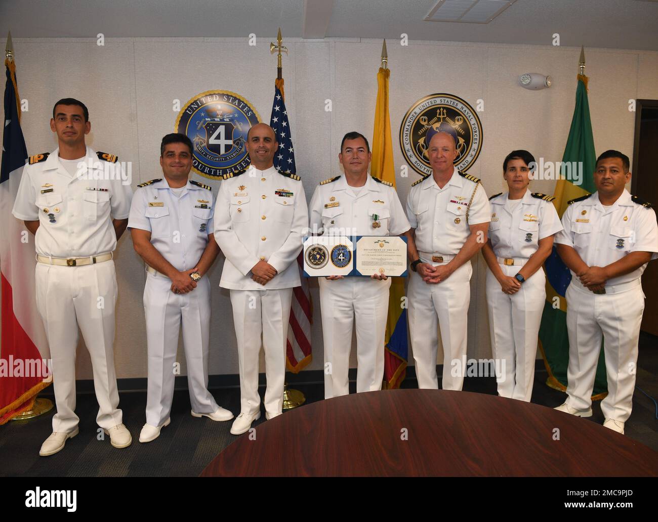 220628-N-DB801-0371  MAYPORT, Fla. – (June 28, 2022) – Colombian navy Capt. Nelson Villalba, center, a Foreign Liaison Officer assigned to U.S. Naval Forces Southern Command/U.S. 4th Fleet, poses with Capt. Michael Weaver, U.S. 4th Fleet Chief of Staff, third from right, and other foreign military officers assigned to the command, after receiving the Navy and Marine Corps Commendation Medal at his end of tour award ceremony at fleet headquarters, June 28, 2022. Villalba served at U.S. 4th Fleet from Jan. 1, 2021 to June 30, 2022. U.S. Naval Forces Southern Command/U.S. 4th Fleet supports U.S. Stock Photo