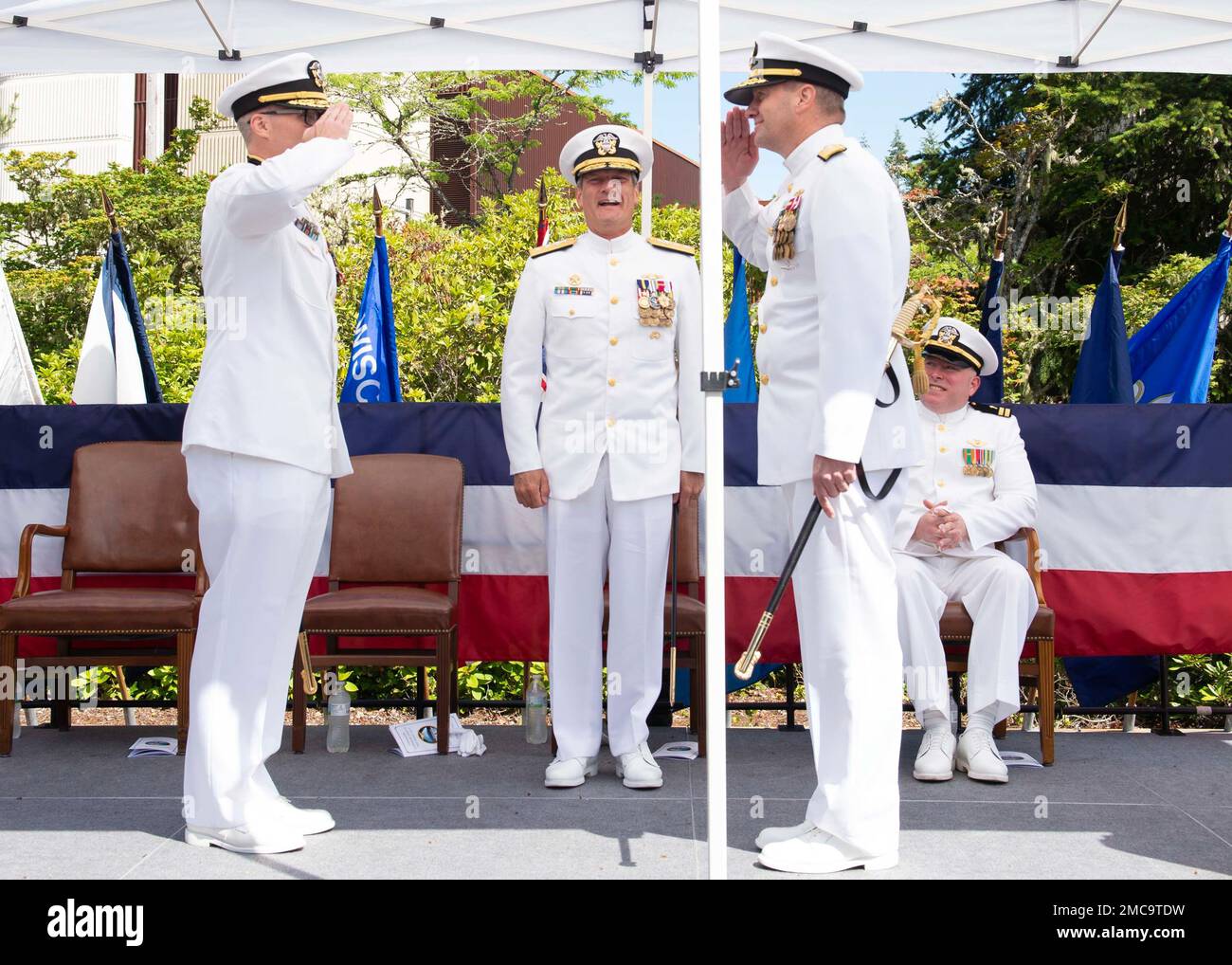 220628-N-ED185-1104    NAVAL BASE KITSAP – BANGOR, Wash. (June 28, 2022) Rear Adm. Robert Gaucher and Rear Adm. Mark Behning salute during a change of command ceremony onboard Naval Base Kitsap – Bangor, Wash., June 28, 2022. Behning relieved Gaucher as the 25th commander of Submarine Group 9. Stock Photo