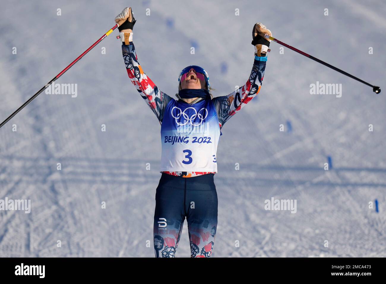 Norways Therese Johaug celebrates after winning the gold medal in the womens 7.5km + 7.5km Skiathlon cross-country skiing competition at the 2022 Winter Olympics, Saturday, Feb