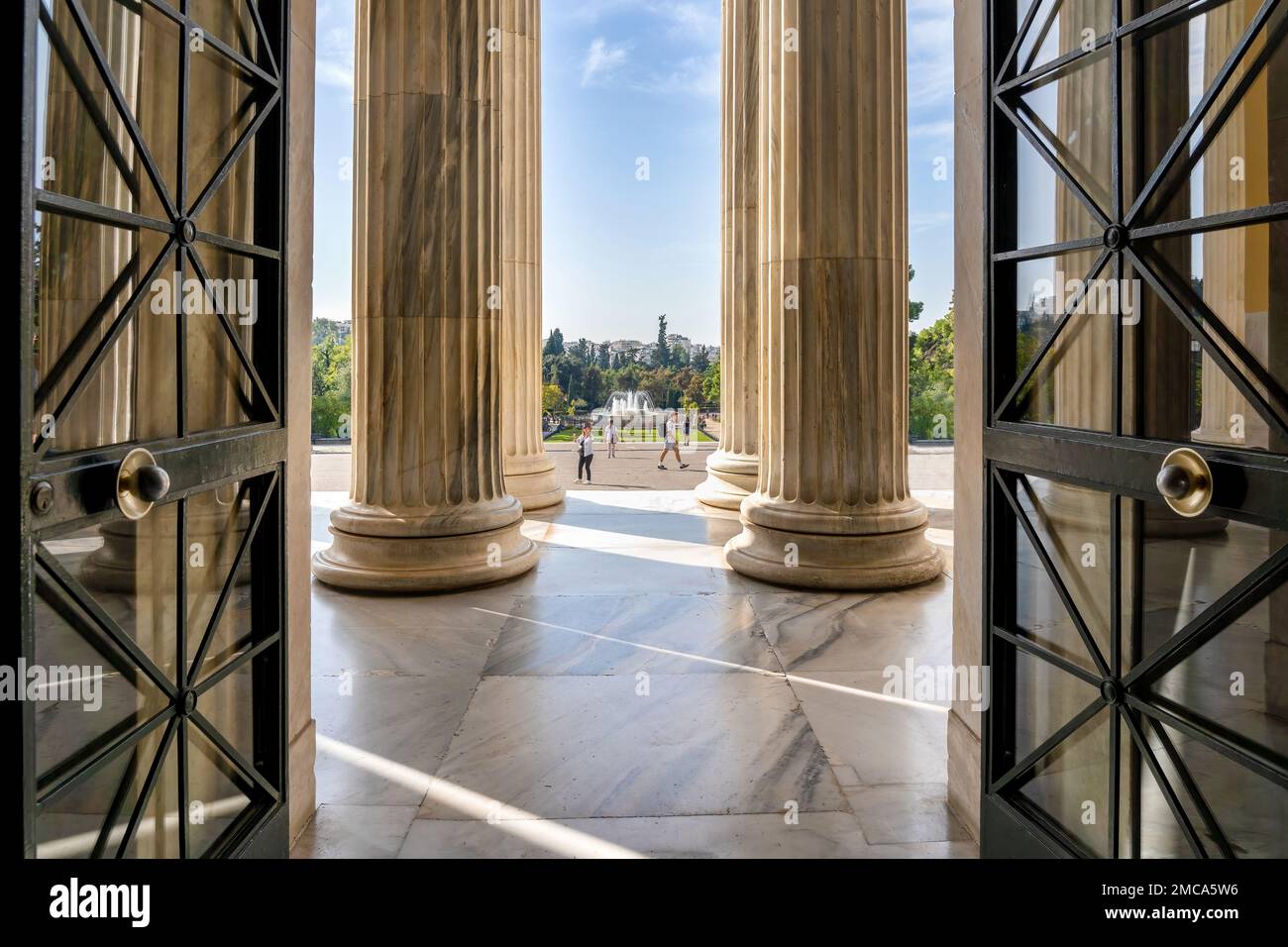 Looking from inside to outside through the door and the columns of the ...