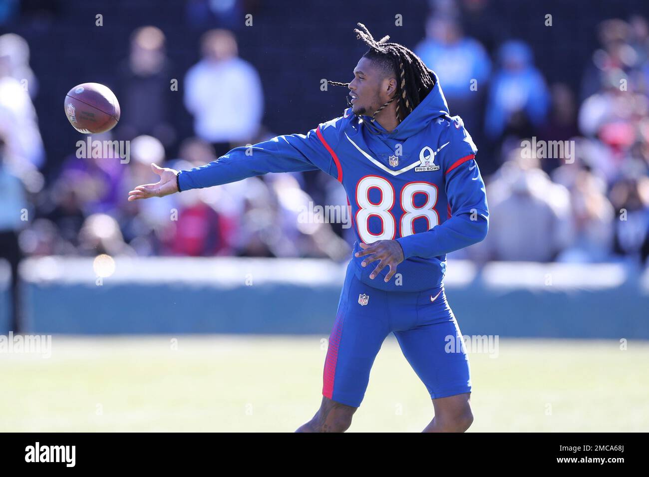 NFC wide receiver CeeDee Lamb of the Dallas Cowboys tosses a ball to a  teammate during Pro Bowl NFL football practice, Friday, February 4, 2022,  in Las Vegas. (Gregory Payan/AP Images for