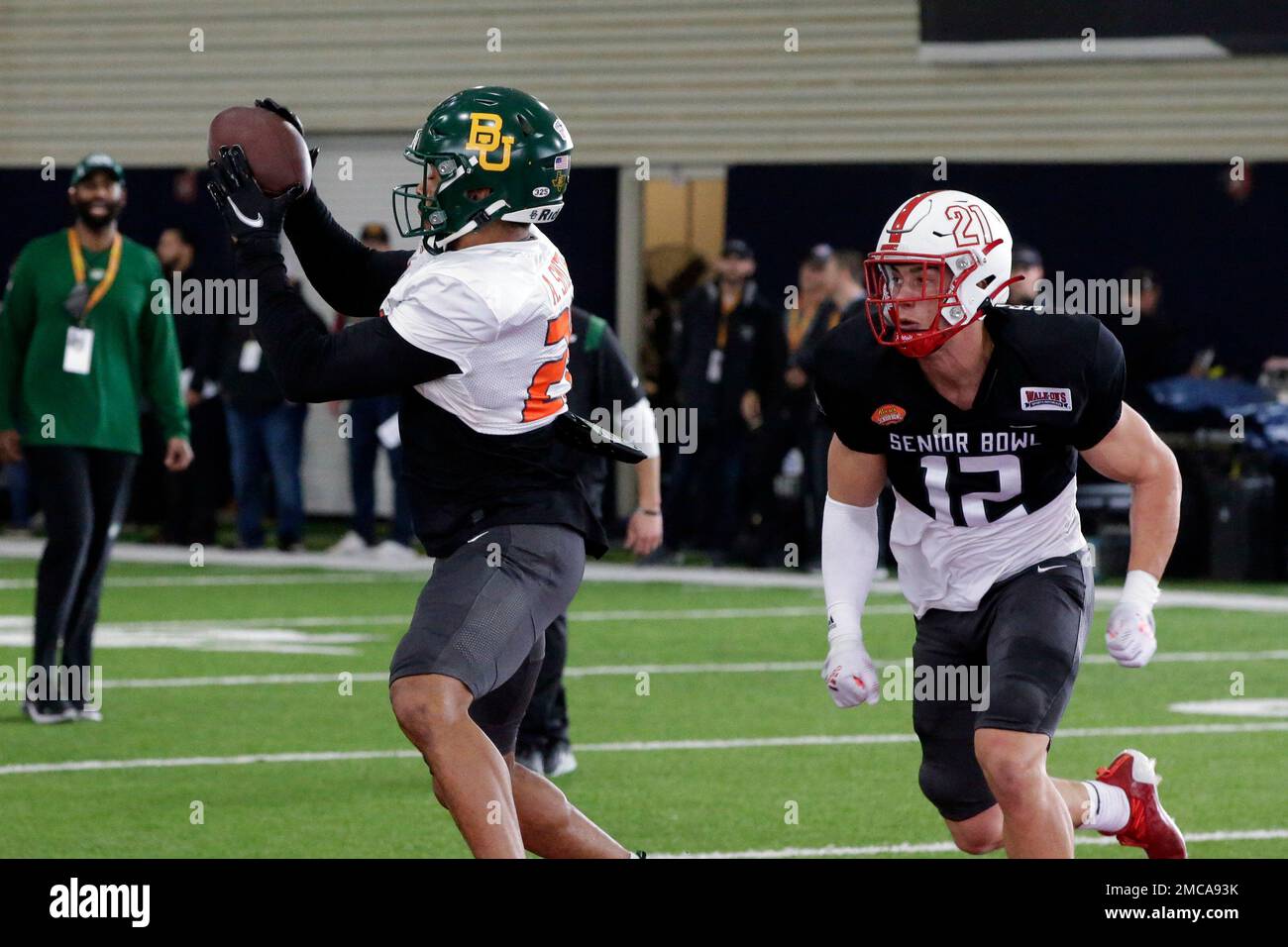 National Team running back Abram Smith of Baylor (28) and National Team linebacker Sterling