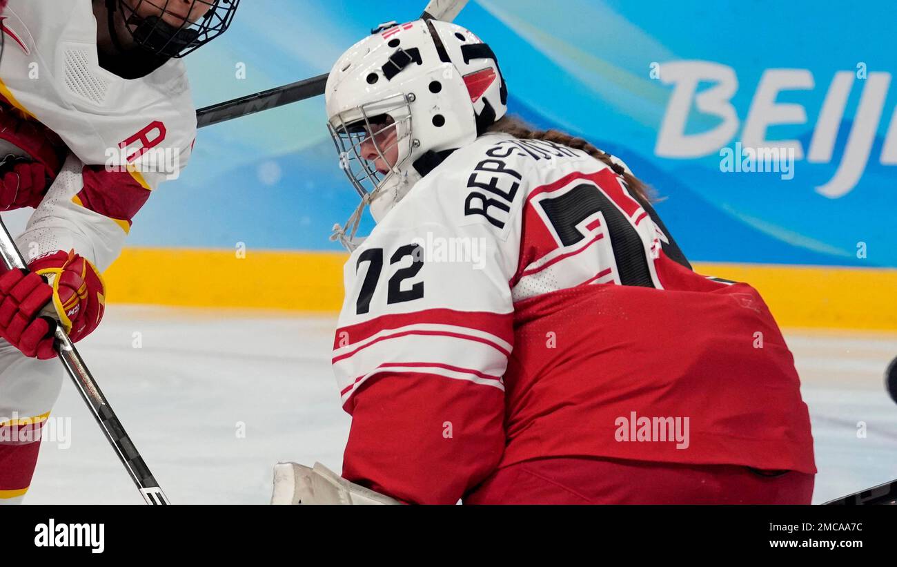 Denmark goalkeeper Cassandra Repstock-Romme (72) defends against a rush by  China's Mulan Kang (17) during a preliminary round women's hockey game at  the 2022 Winter Olympics, Friday, Feb. 4, 2022, in Beijing. (