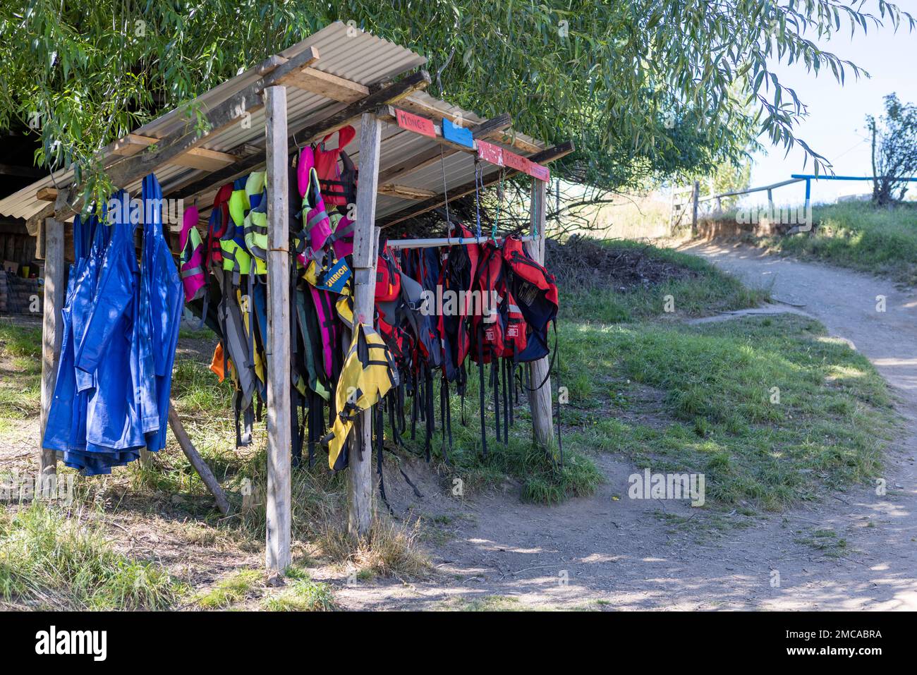 Life vests for kayak tours hanging in a shelter at the beach of Lago General Carrera near Puerto Rio Tranquilo, Chile Stock Photo