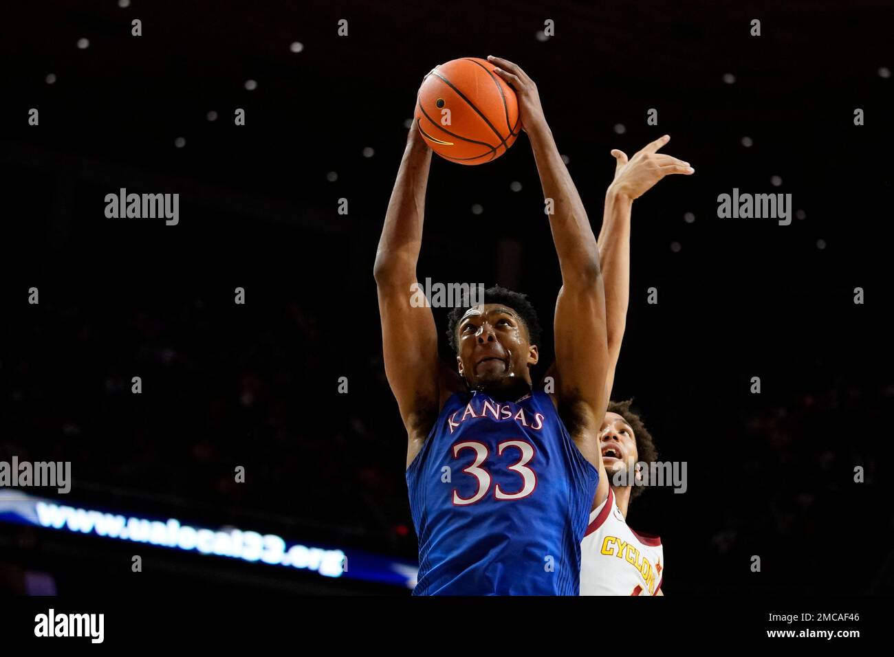 Kansas forward David McCormack (33) grabs a rebound ahead of Iowa State
