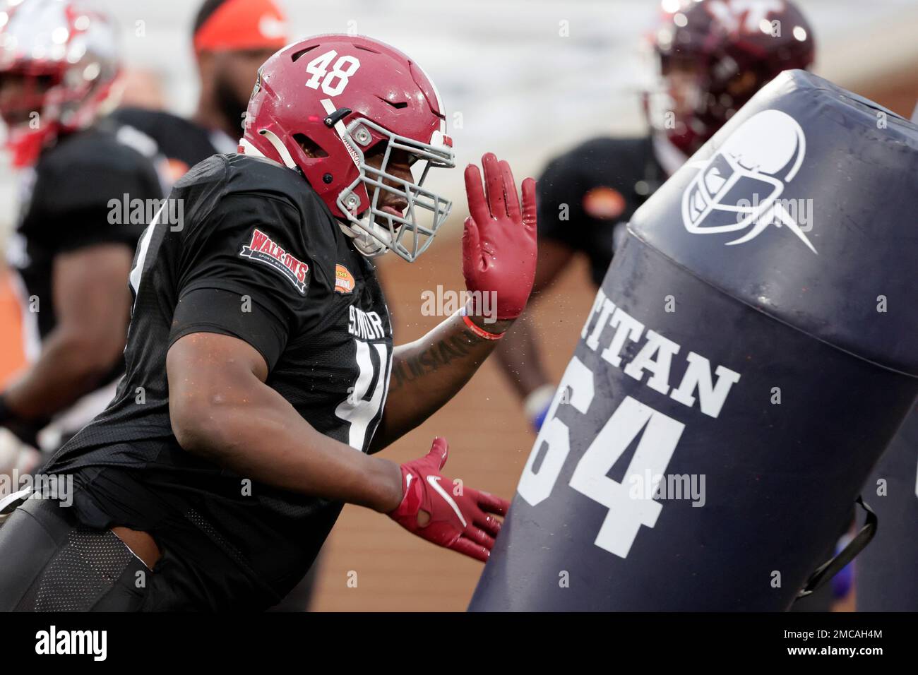 American Team defensive lineman Phidarian Mathis of Alabama runs through drills during practice