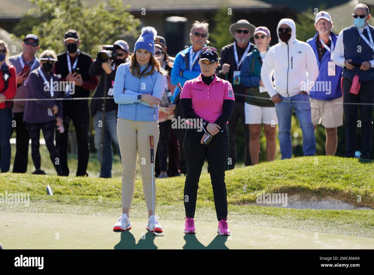 Hally Leadbetter, left, and Pressel wait to putt on The Hay