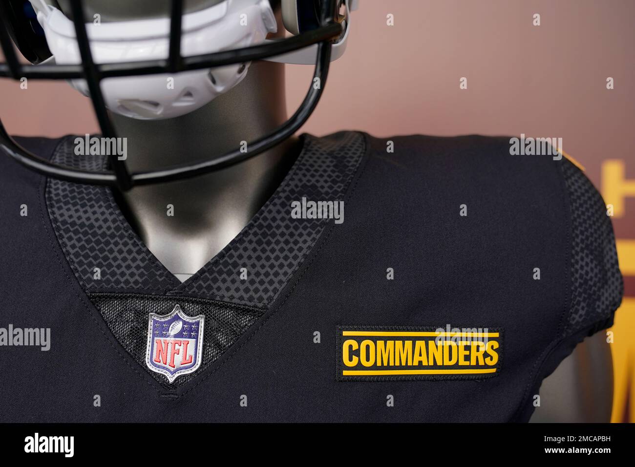 The Washington Commanders' logo is displayed on a jersey at an event to  unveil the NFL football team's new identity, Wednesday, Feb. 2, 2022, in  Landover, Md. The new name comes 18