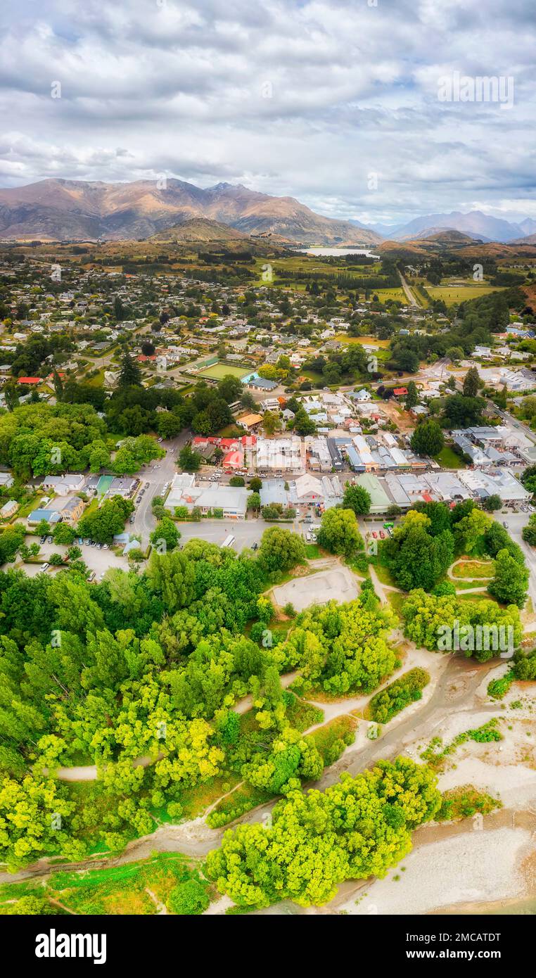 Scenic vertical aerial panorama from Arrow river to Arrowtown and lake Hayes in New Zealand. Stock Photo