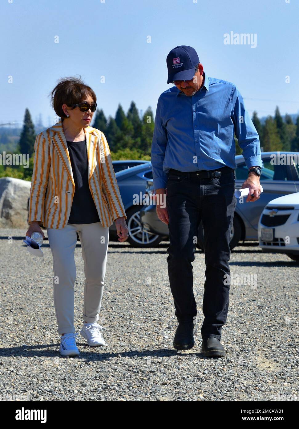 Rep. Doris Matsui (CA-06) walks with Michael Connor, assistant secretary of the Army for civil works, during a visit to Folsom Dam Dike 8 in Folsom, California, June 28, 2022. Connor visited the U.S. Army Corps of Engineers Sacramento District, which raised Dike 8 by 3.5 feet in 2020, to better understand the flood control infrastructure in the Sacramento area and how the district has been partnering with state and local agencies to improve this infrastructure over the last few decades. Planned improvements to the rest of Folsom Dam include 3.5-foot raises of Dikes 1-7, the Left and Right Wing Stock Photo